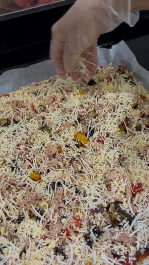 Generous cheese blend added over the tuna and vegetables