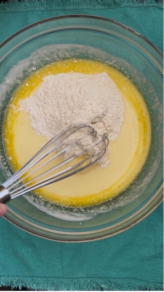 Flour and baking powder added to the buttermilk pancake batter