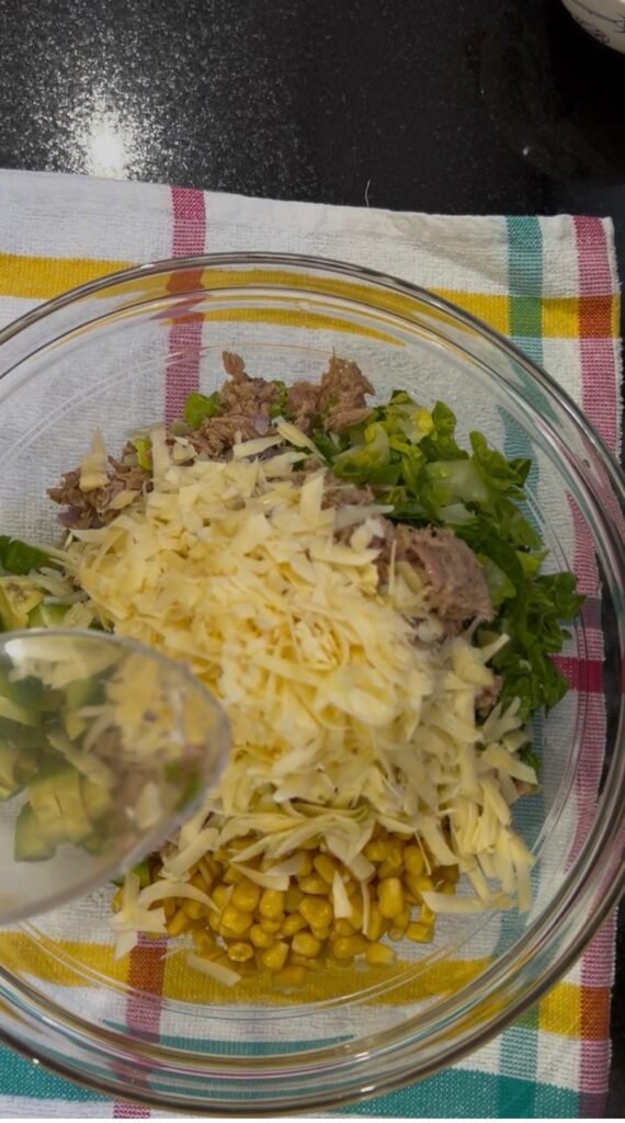 Grated cheese added to the tuna wrap filling before dressing
