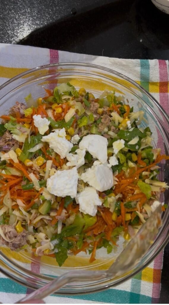 Crumbled soft cheese layered over the tuna and vegetable filling