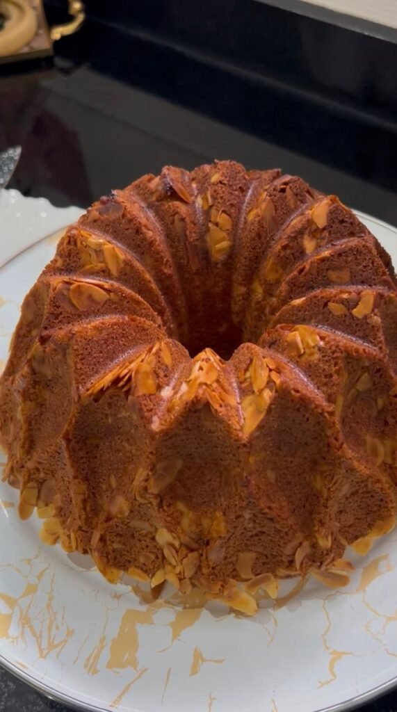 Baked almond bundt cake with golden toasted almond crust