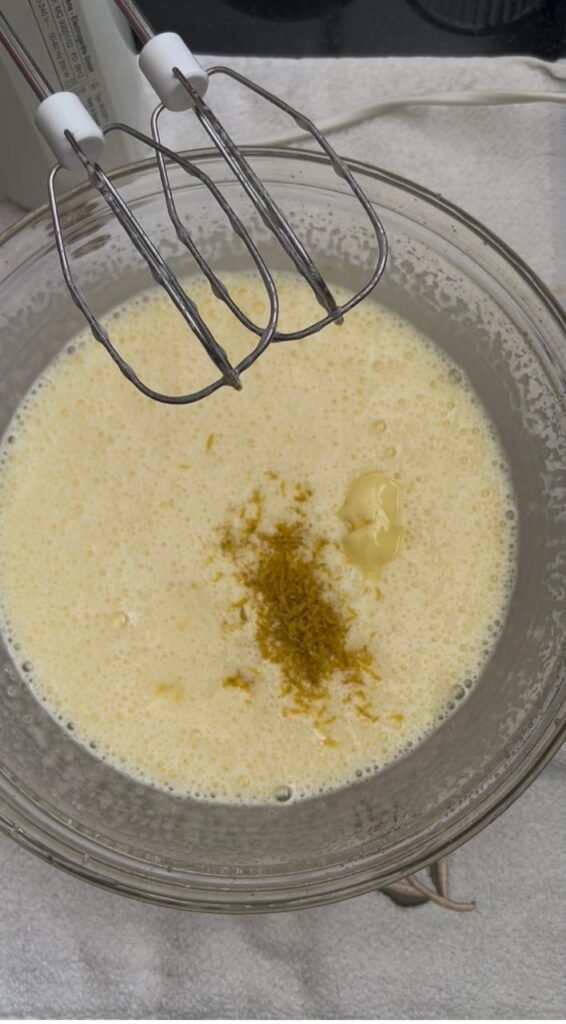 Whipped egg and sugar base with lemon zest and butter