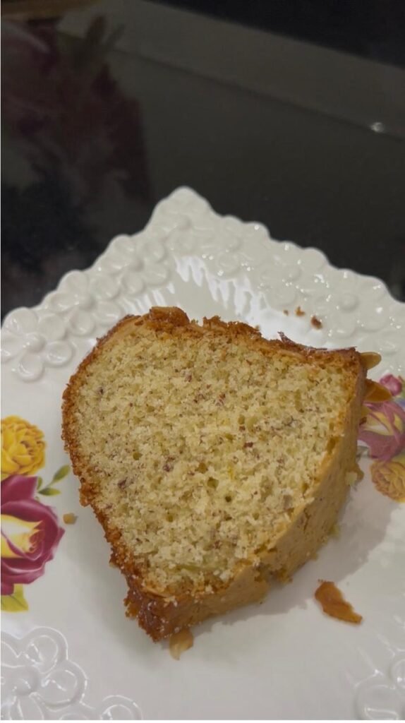Slice of almond cake served on a decorative plate