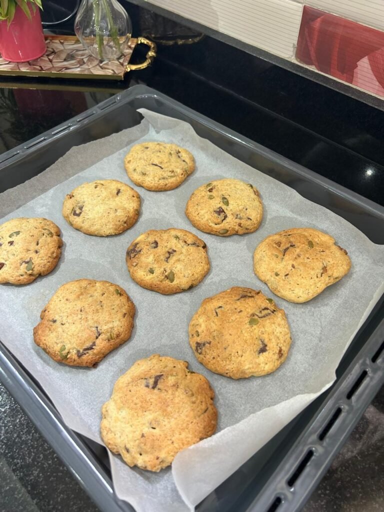 Baked chocolate walnut cookies cooling on the baking tray