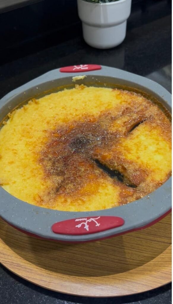 Baked Venezuelan flan cooling in the pan before chilling