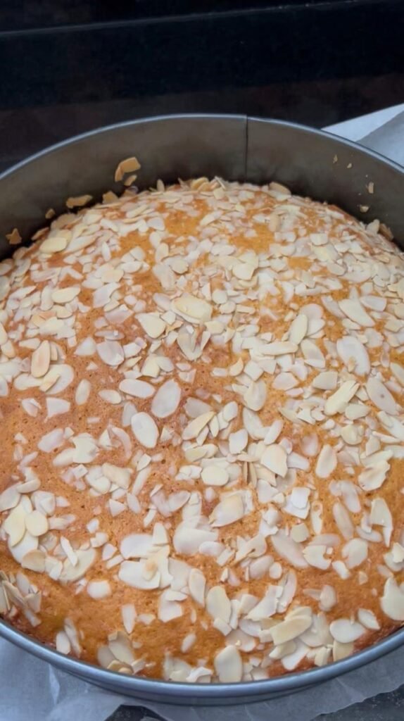Baked orange almond cake with a golden toasted almond top
