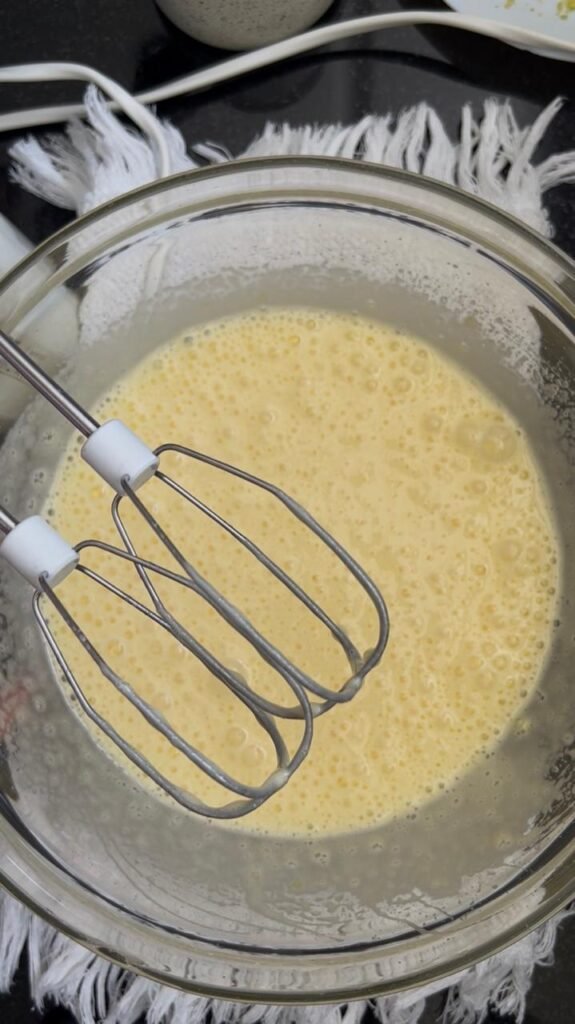 Eggs and sugar beaten pale and foamy before adding the flavors