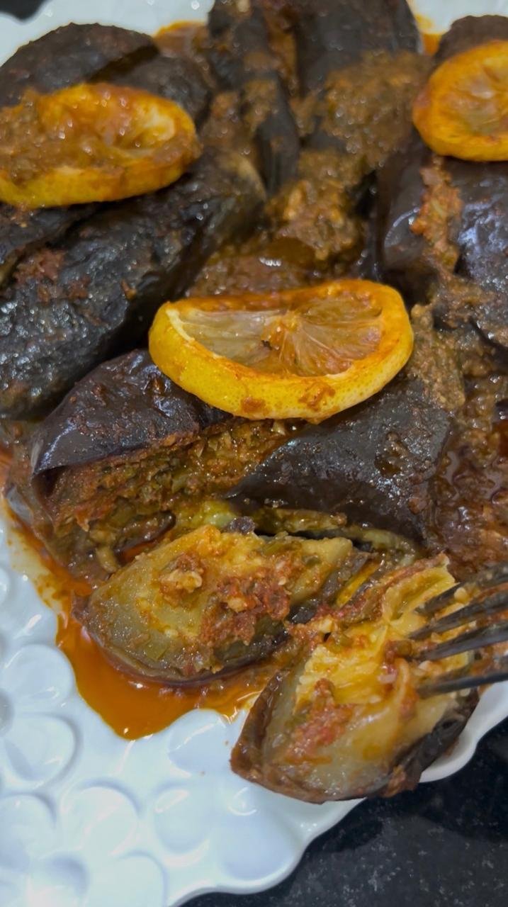 Chermoula stuffed eggplant braised in garlic herb sauce with lemon