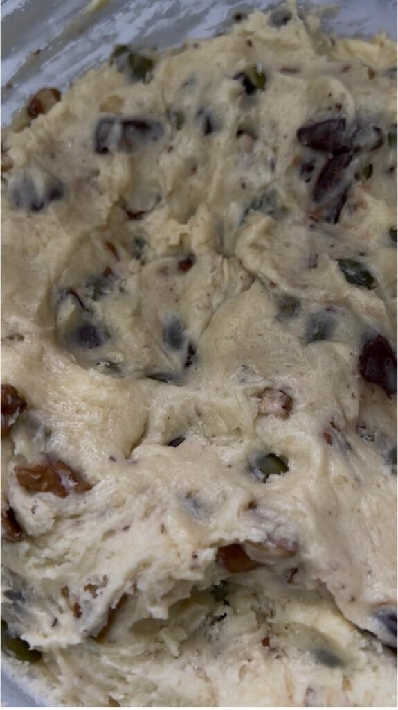 Chocolate walnut cookie dough with visible chunks, nuts and seeds