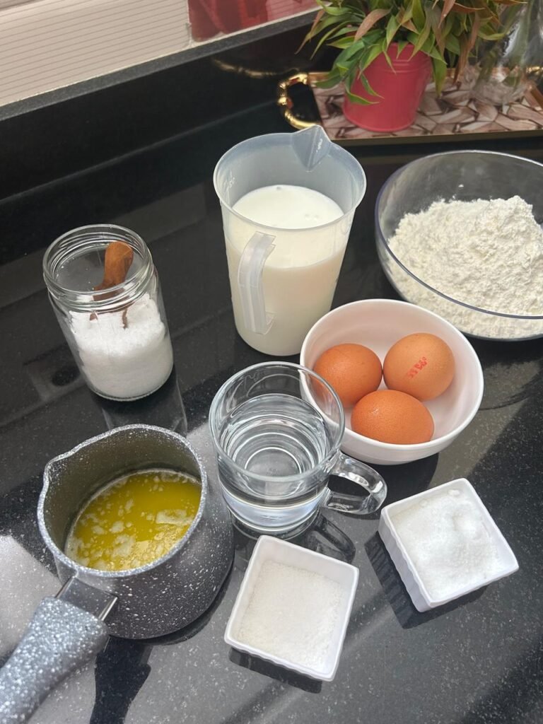Ingredients for buttermilk crepes: flour, buttermilk, eggs, butter and sugar