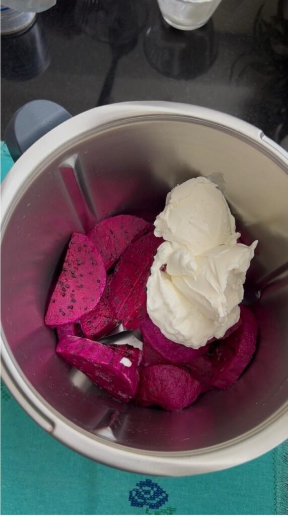 Frozen dragon fruit pieces with cream cheese before blending