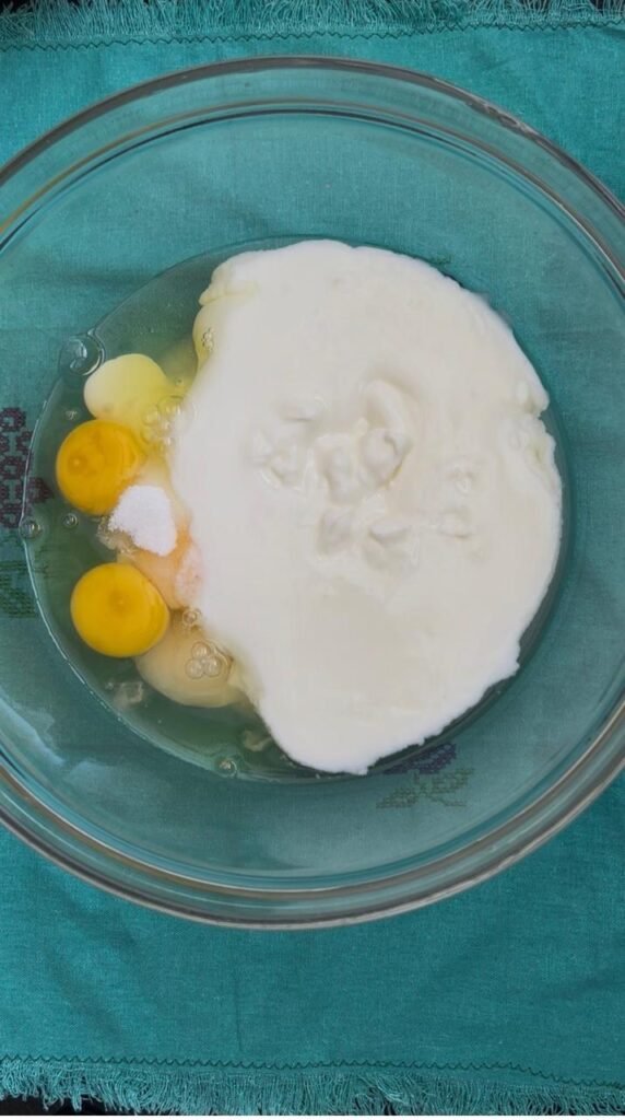Eggs, yogurt and buttermilk in one bowl for pancake batter