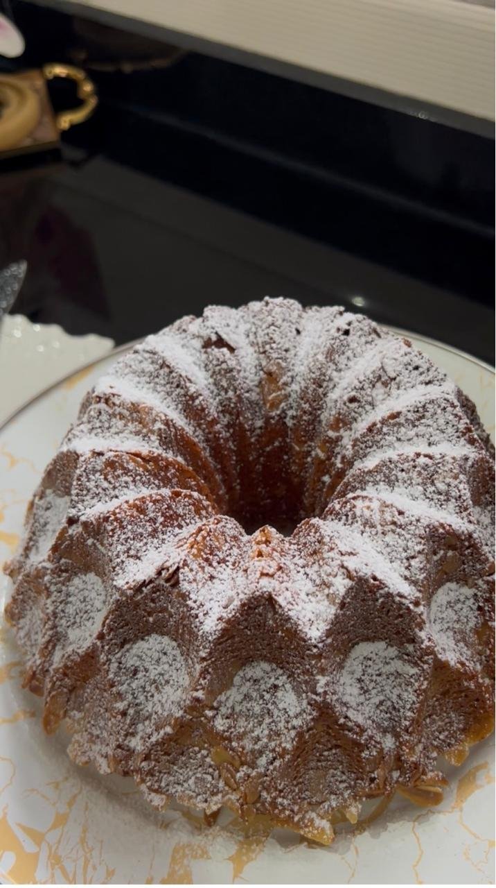 Golden almond bundt cake dusted with powdered sugar