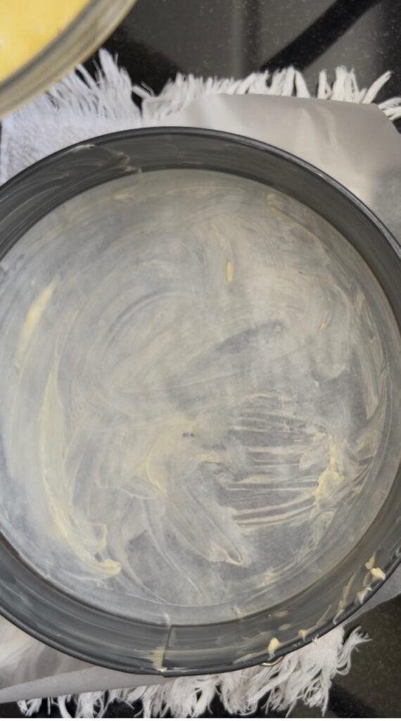Greased and parchment-lined 28 cm cake pan
