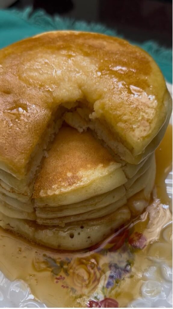 Cut fluffy buttermilk pancakes showing the soft layered inside