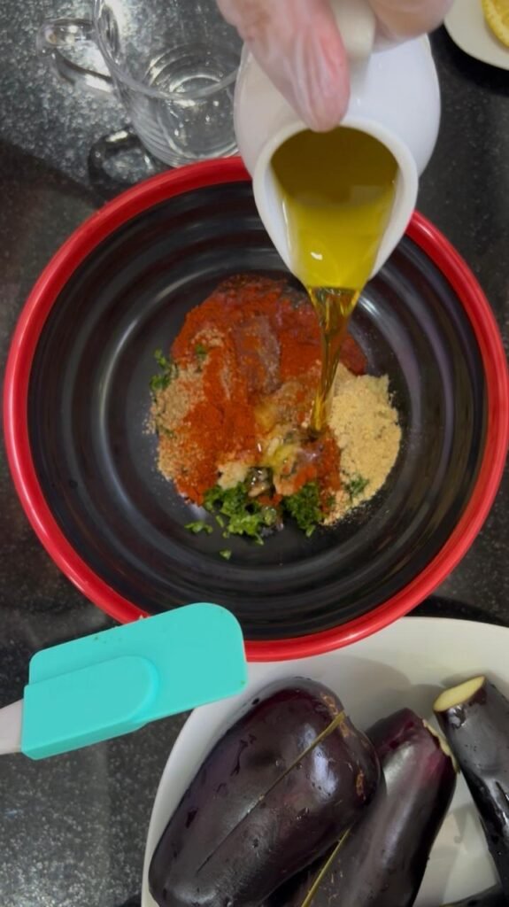 Olive oil poured over spices to make the chermoula marinade