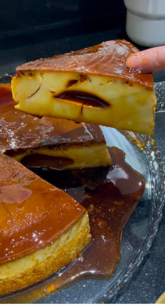 Slice of quesillo showing the signature holes and caramel top