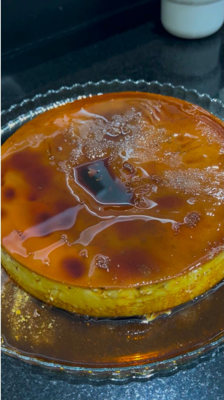 Whole Venezuelan flan with glossy caramel dripping down the sides
