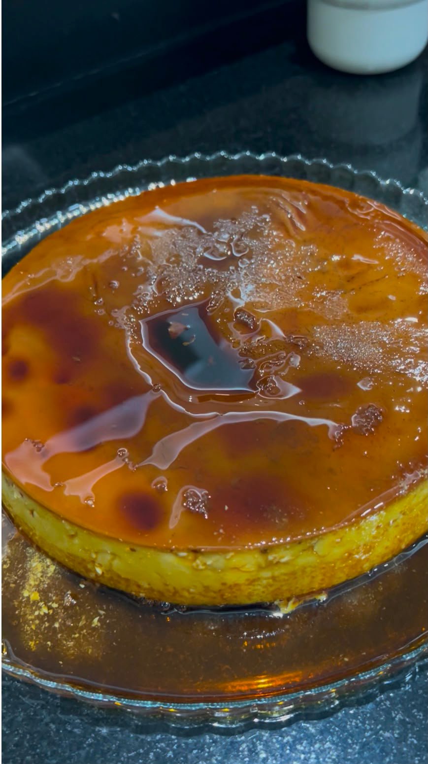 Whole Venezuelan flan with glossy caramel dripping down the sides