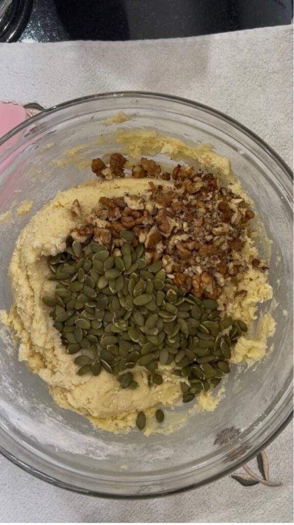 Walnuts and green pumpkin seeds folded into cookie dough