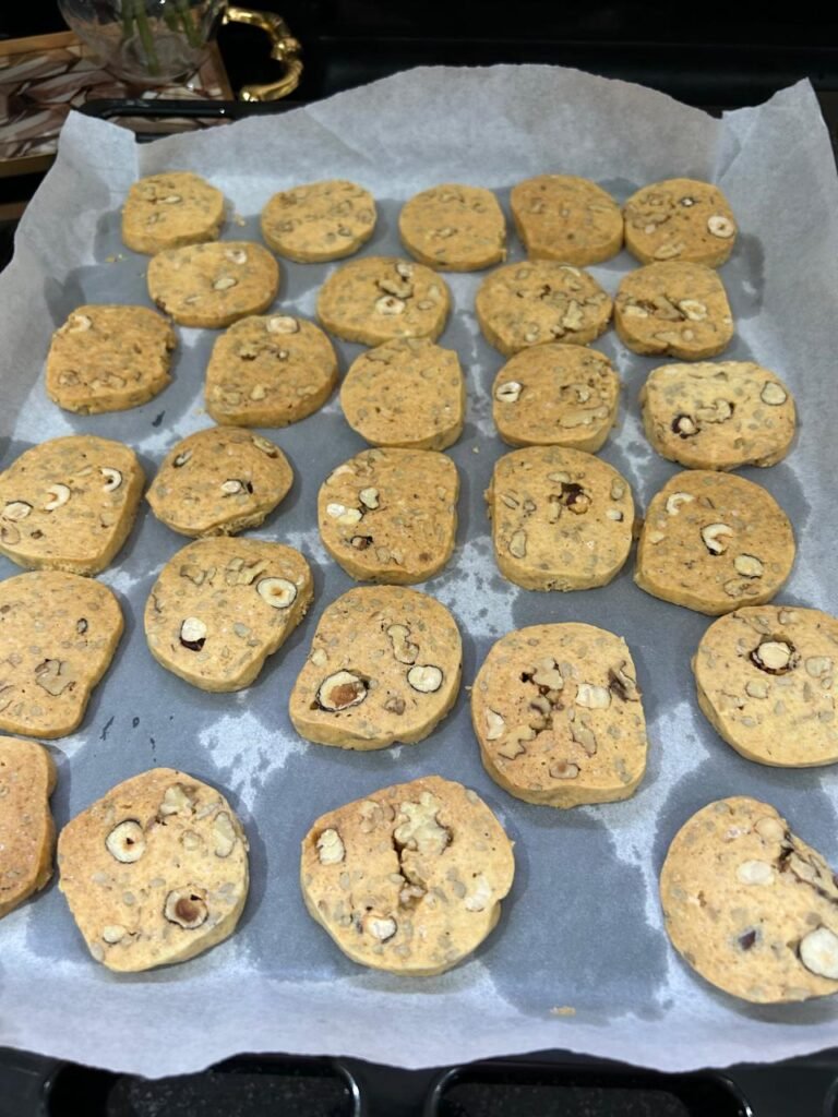 Golden baked nut and seed shortbread cookies on a tray