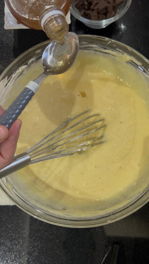 Wet ingredients blended smooth and frothy with immersion blender for banana chocolate cake