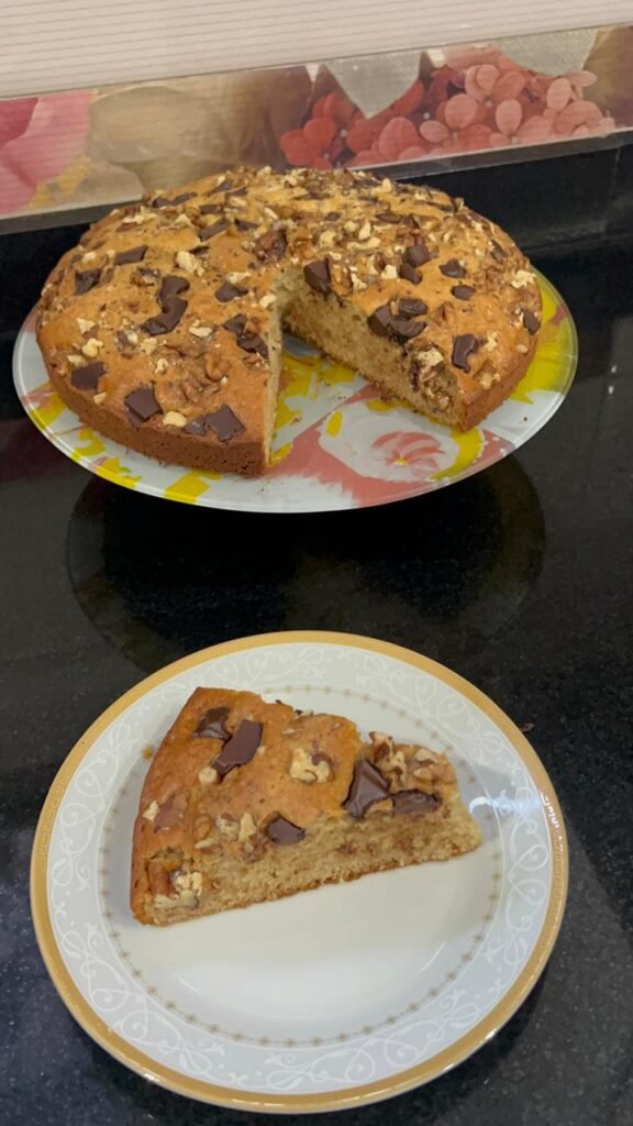 Whole easy banana chocolate cake sliced to show moist, tender crumb structure