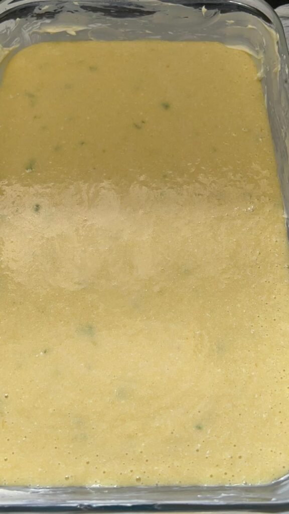 Basbousa batter poured into baking pan, ready to bake