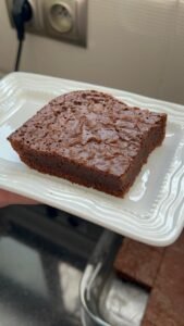 A fudgy brownie square with a crackly top and soft center