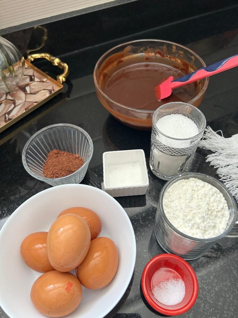 Ingredients for fudgy brownies including dark chocolate and cocoa