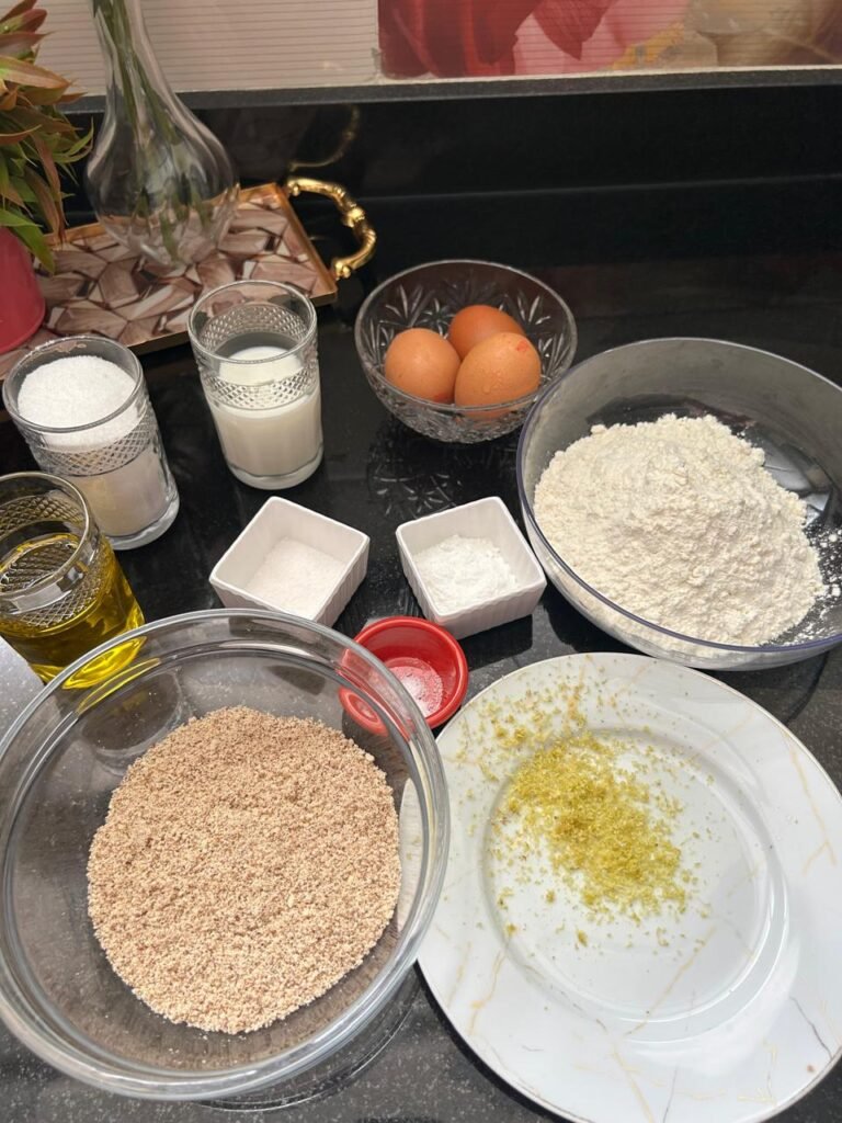 Ingredients for lemon almond cake including almond flour, eggs, and lemon zest