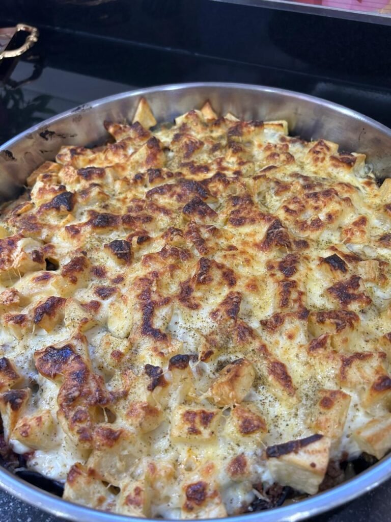 Fully baked easy make-ahead moussaka with golden gratinéed cheese top