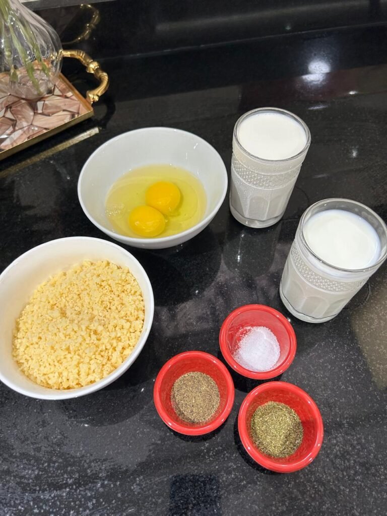 Eggs, milk, cream, cheese and spices for quiche custard