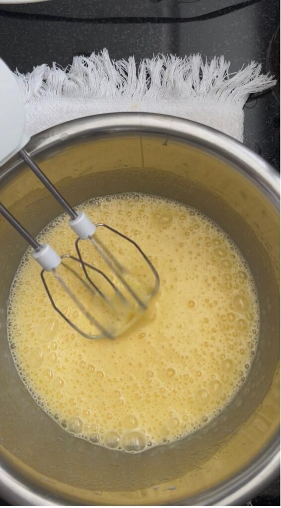 Whisked eggs and sugar looking pale and foamy