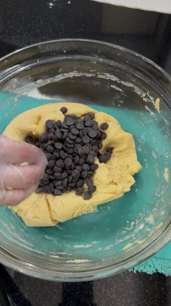 Chocolate chips kneaded into easy chocolate chip cookie bar dough evenly throughout