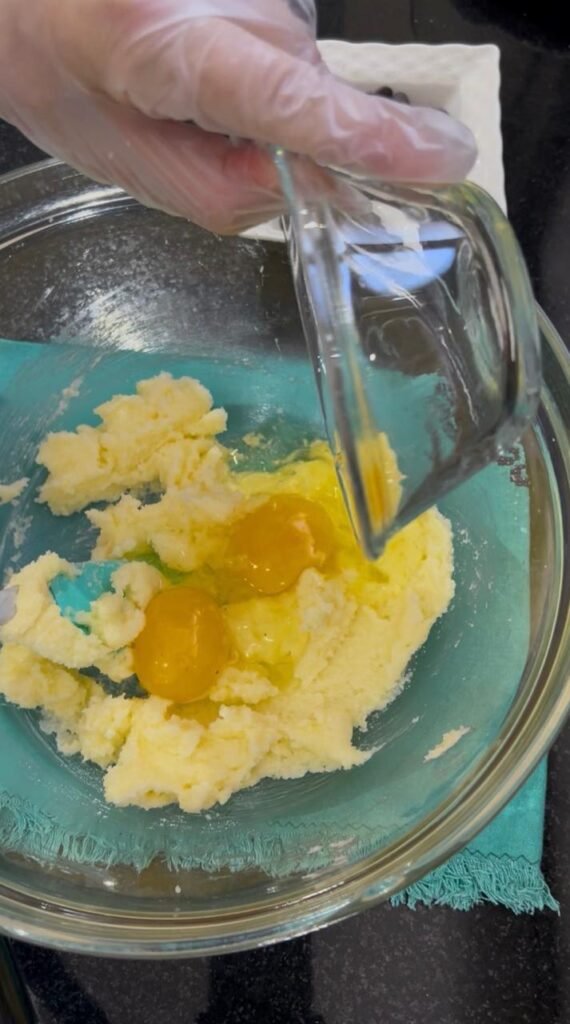 Eggs whisked into creamed butter and sugar mixture for cookie bar base
