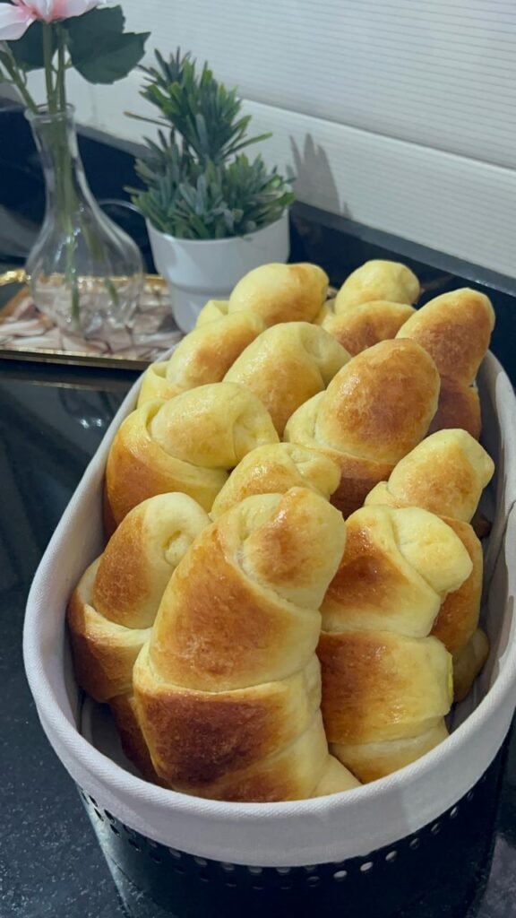 Homemade crescent rolls cooling on wire rack after baking, ready to fill or serve