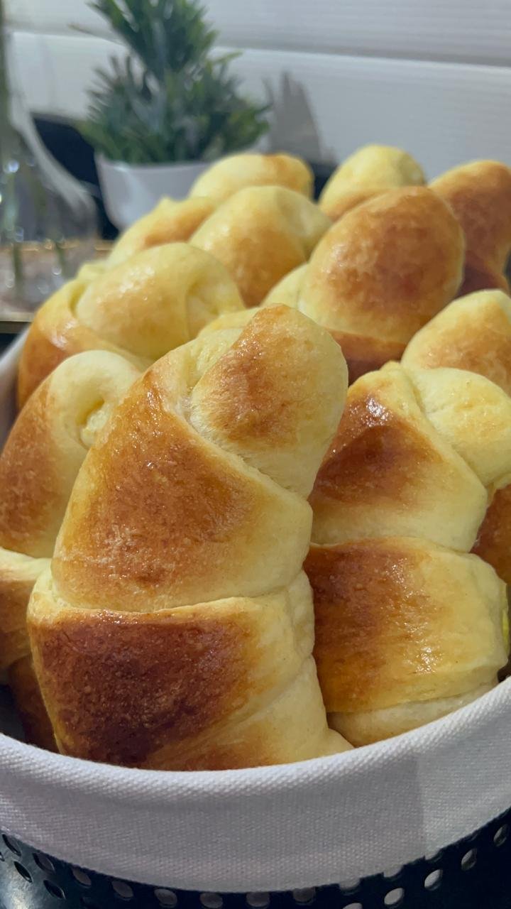 Homemade crescent rolls cooling on wire rack after baking, ready to fill or serve