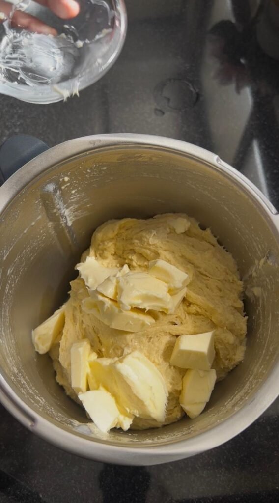 Smooth elastic dough after kneading with semolina, flour, yogurt, eggs, butter for homemade crescent rolls