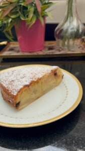 Easy peach cake slice showing fresh peach, vanilla crumb, and chocolate chips